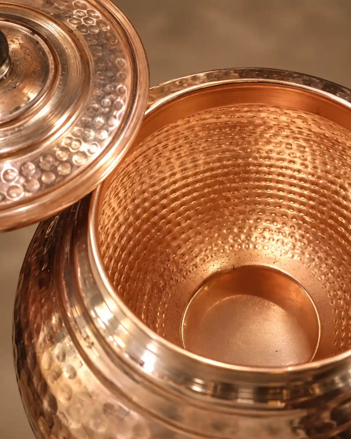 Interior of 9L pure copper water dispenser showing handcrafted hammered copper texture