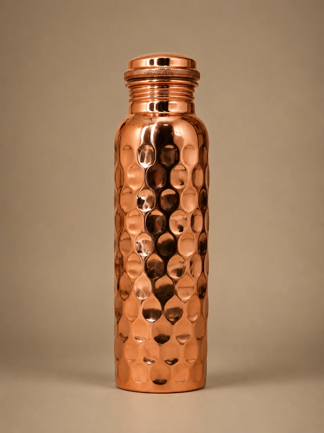 Cupreva Diamond Hammered Pure Copper Water Bottle 900ml on a neutral background