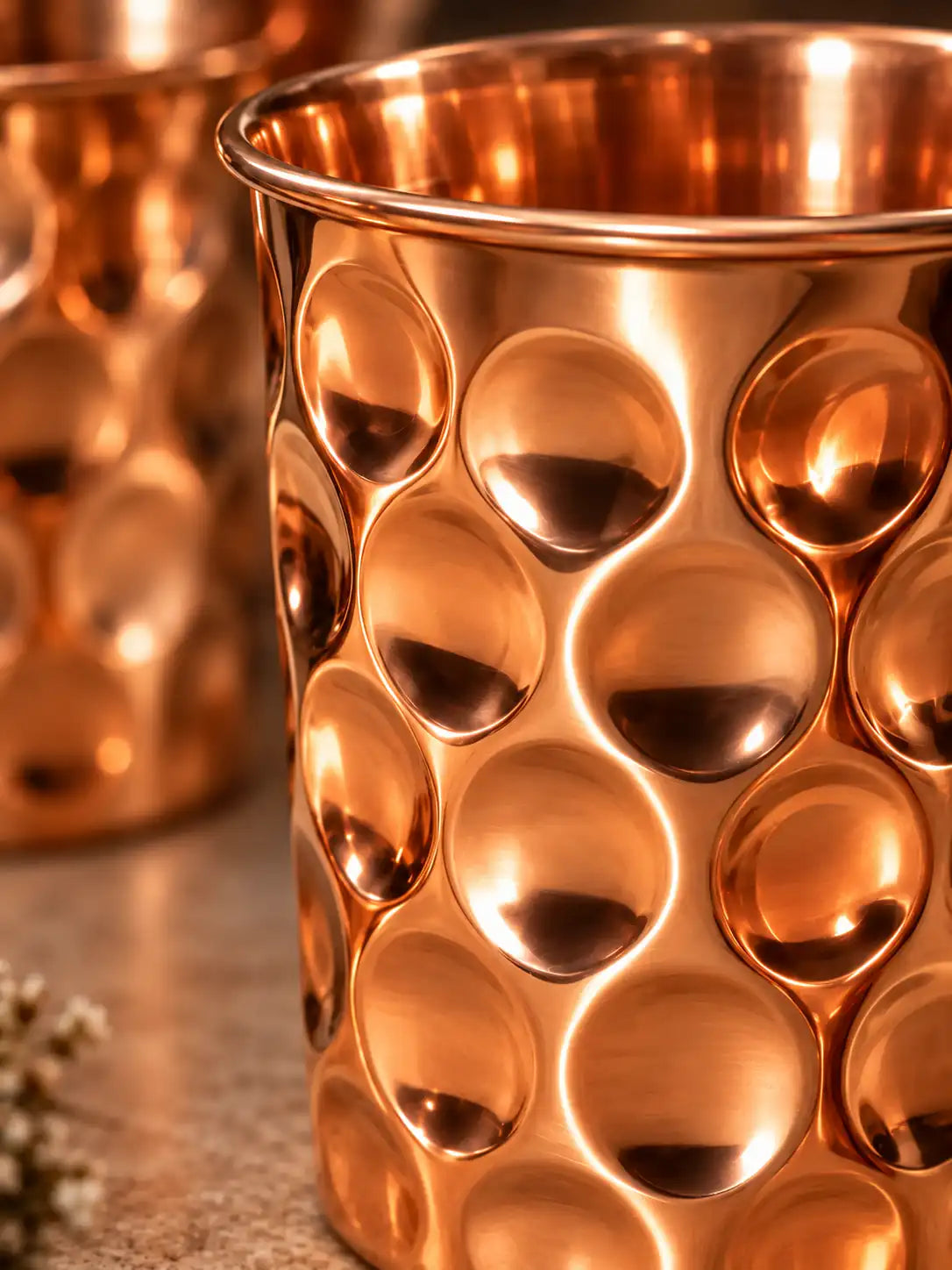 Close-up of the diamond hammered texture and natural finish on a pure copper drinking glass