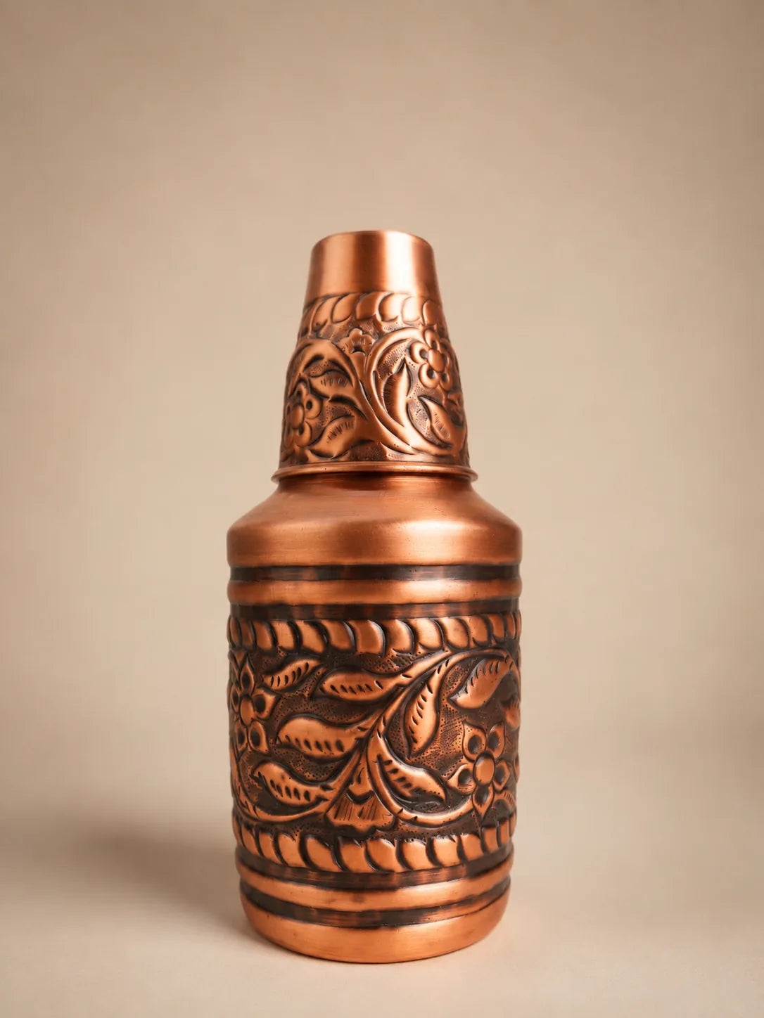 Embossed pure copper water carafe with handcrafted floral design