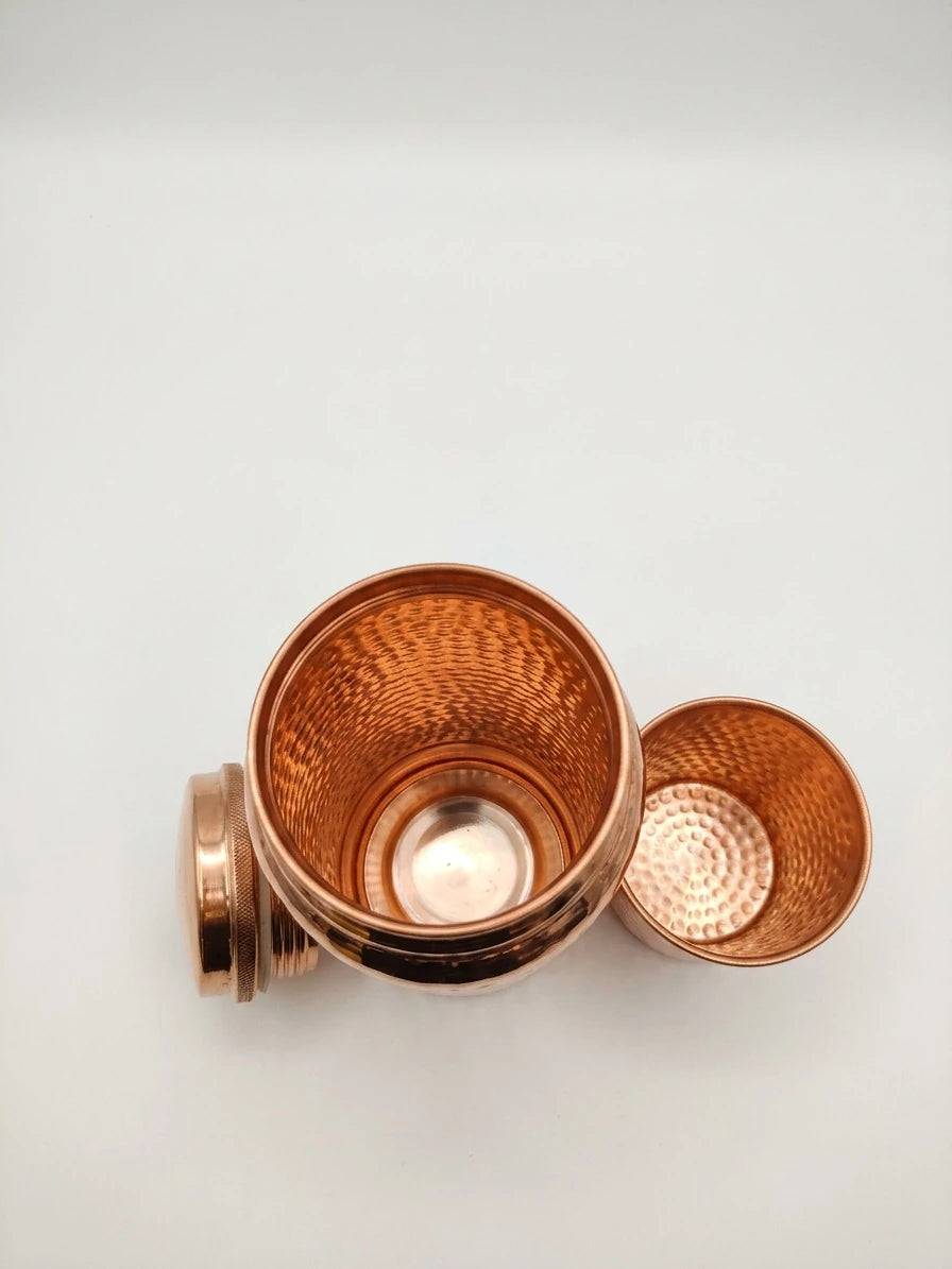 Hammered pure copper water bottle with matching copper glass and lid for Ayurvedic drinking water