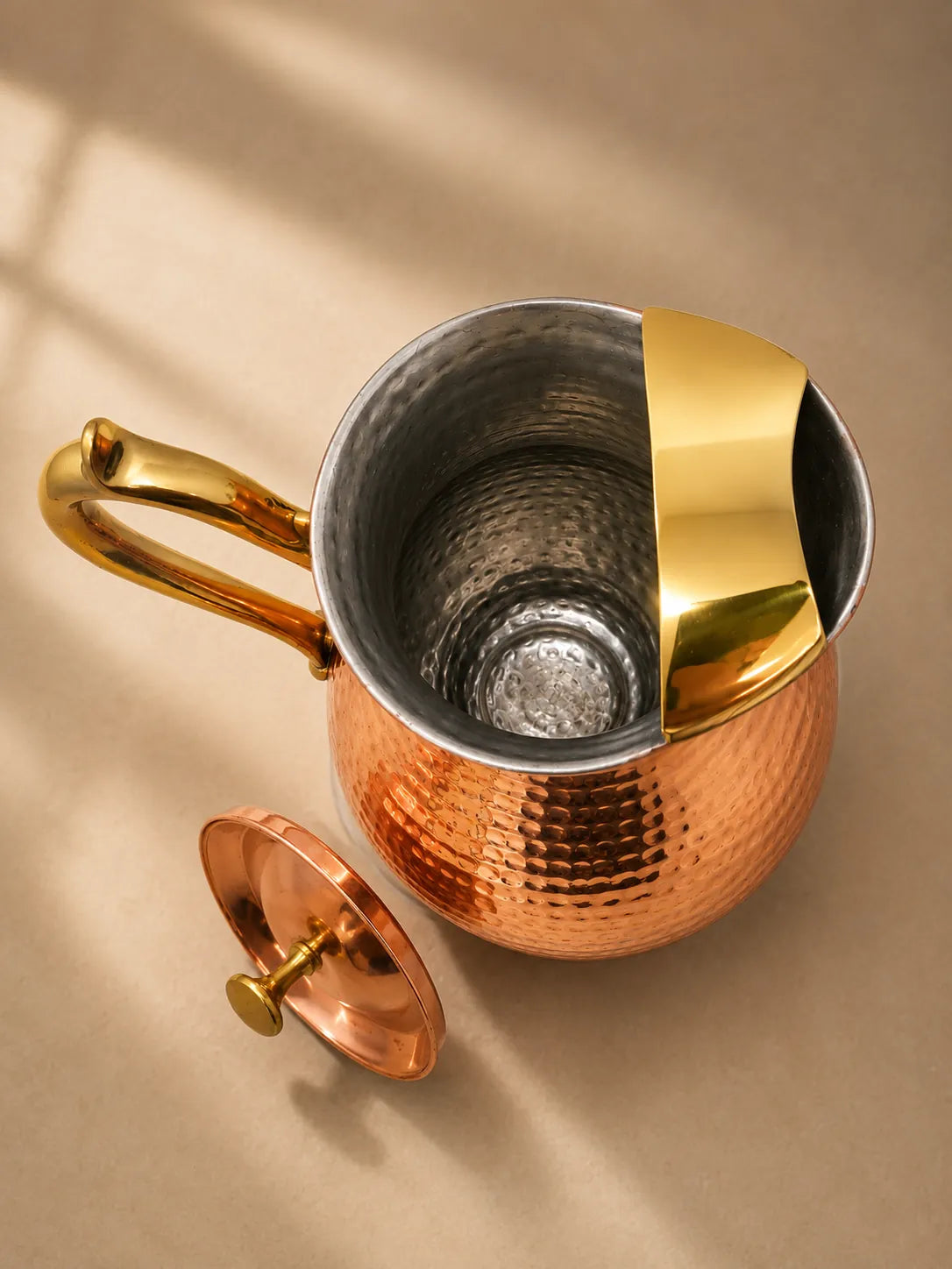 Top view of the Cupreva Royal Hammered Pure Copper Water Pitcher with removable lid